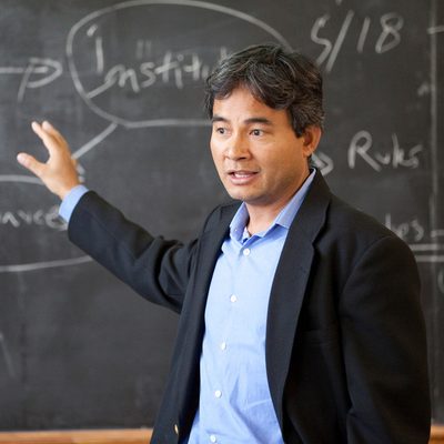 photo of Tun Myint in front of chalkboard