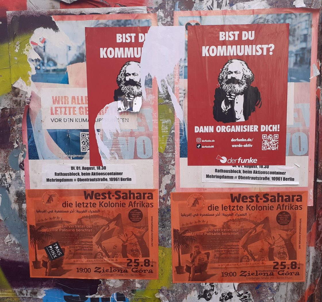 photos of Marxist posters pinned to wall