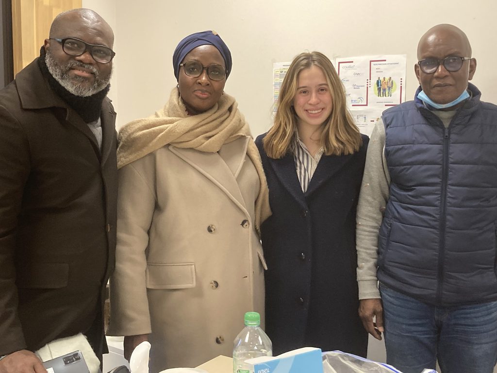 4 people, including Natalia Crimmel, stand smiling at camera
