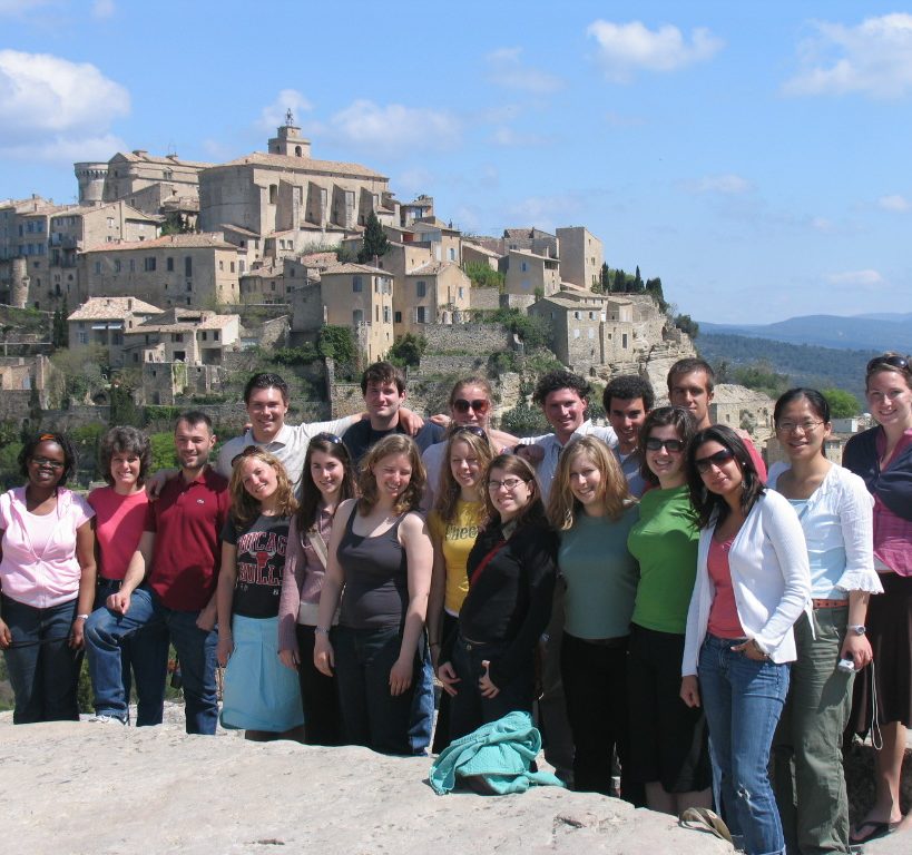 students pose on top of hillside