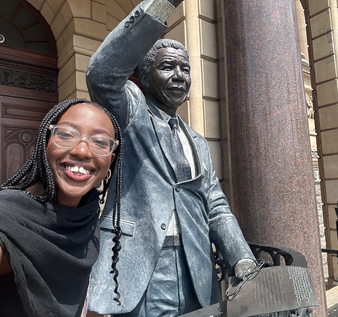 Tiffany Nyamao with a statue
