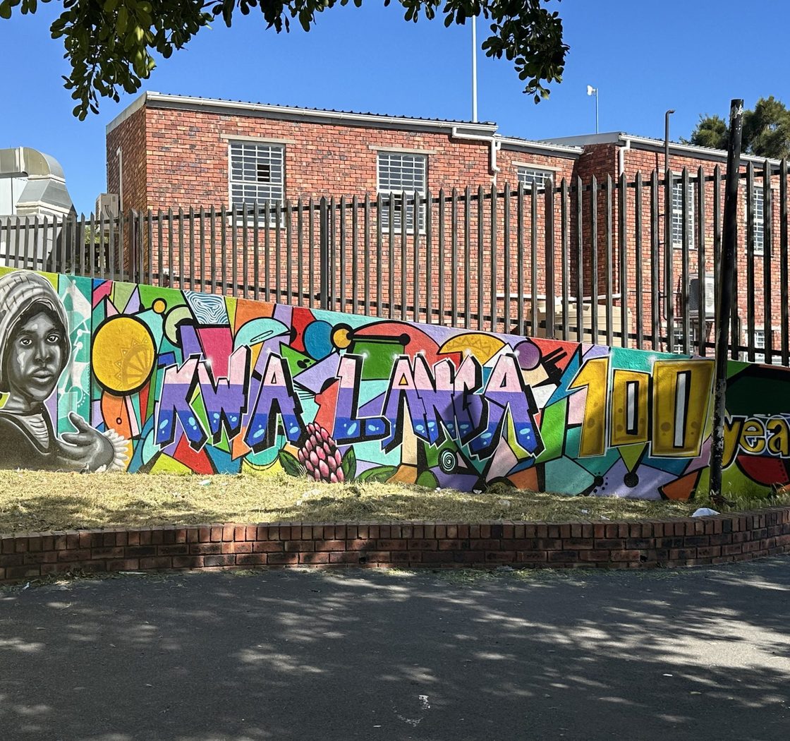 Outdoor graffiti with words Kwa Lanca 100 years