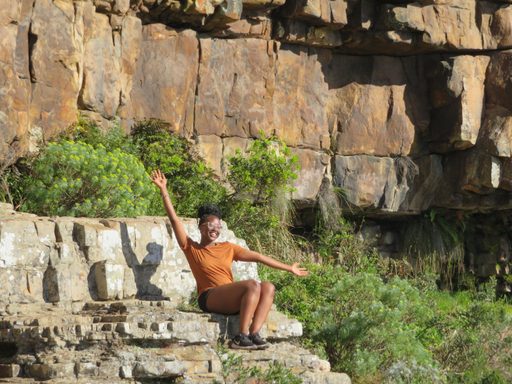 Tiffany Nyamao outside on rocks