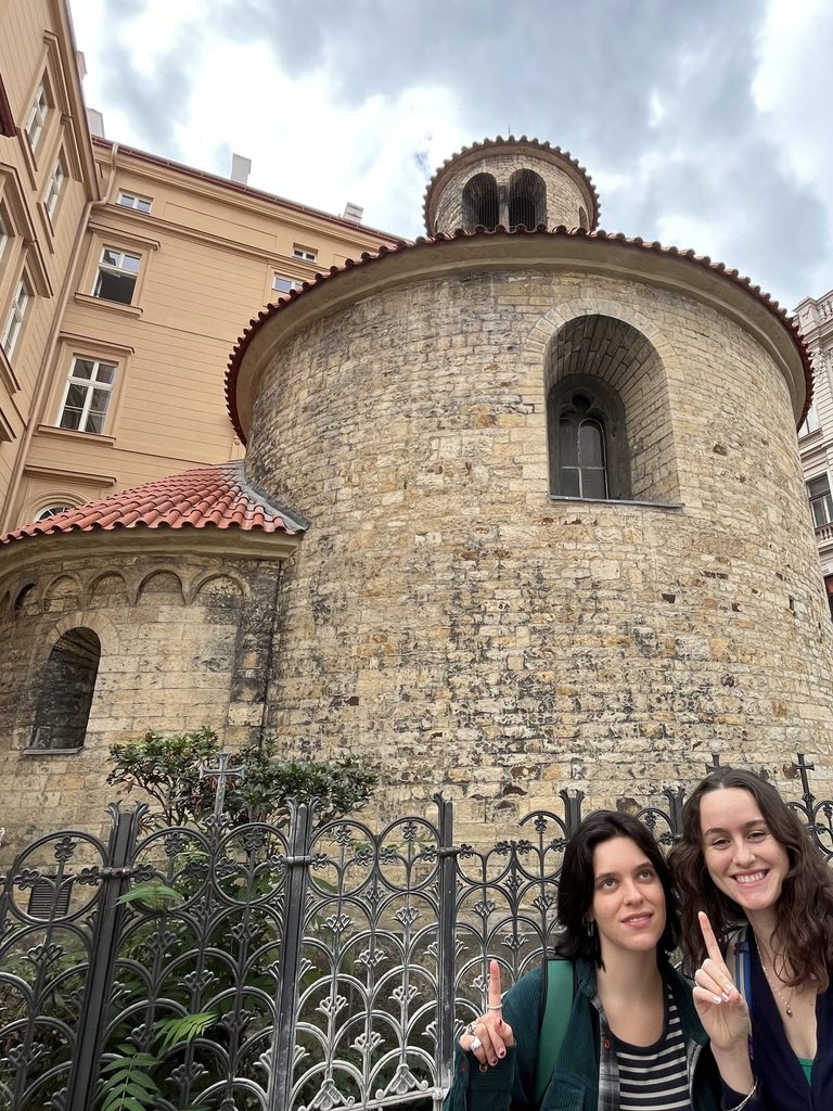 standing in front of the Romanesque Rotunda
