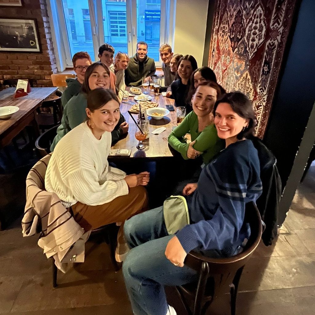 trying traditional Czech bar food of pickled Camembert and Sausage