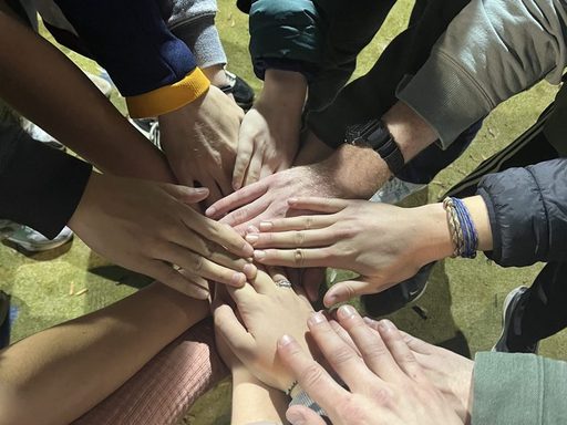 Hands in! Our team and cheerleaders celebrate our win