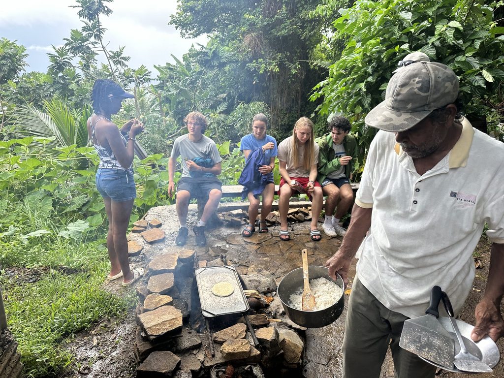 Students make food in jungle
