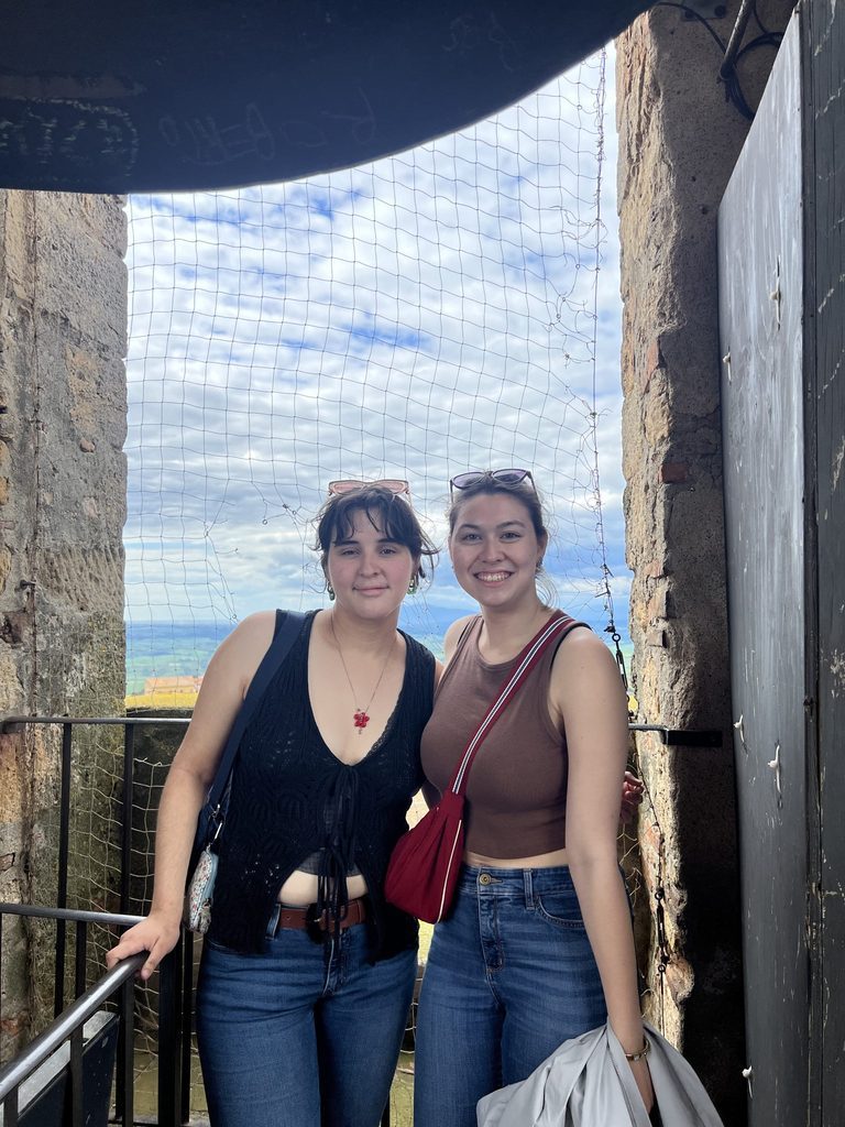 two students at top of bell tower