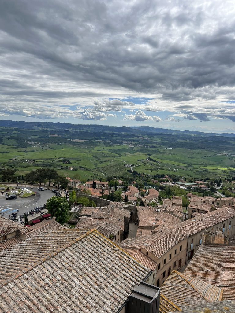 Tuscan landscape with buildings and green hills