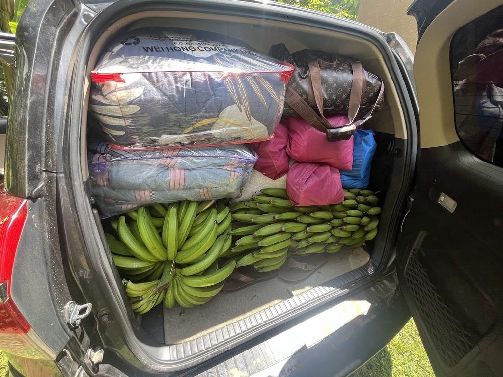 Car packed with clothes and plantains
