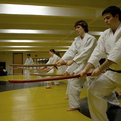 Aikido students practice waist strikes