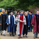 Faculty leading the graduates into Commencement 2022