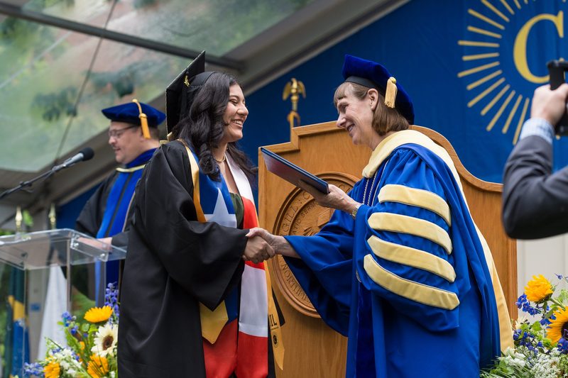 Graduate receiving diploma from President Byerly