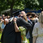 Student hugs love ones.