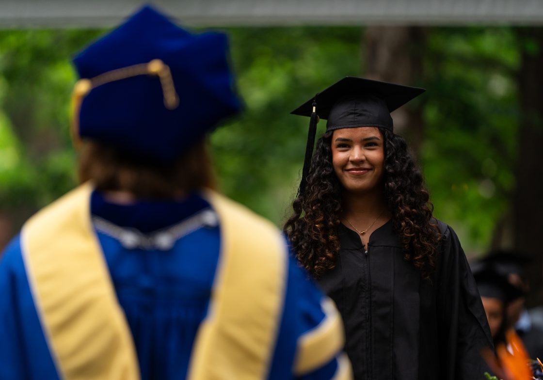 graduate on commencement stage