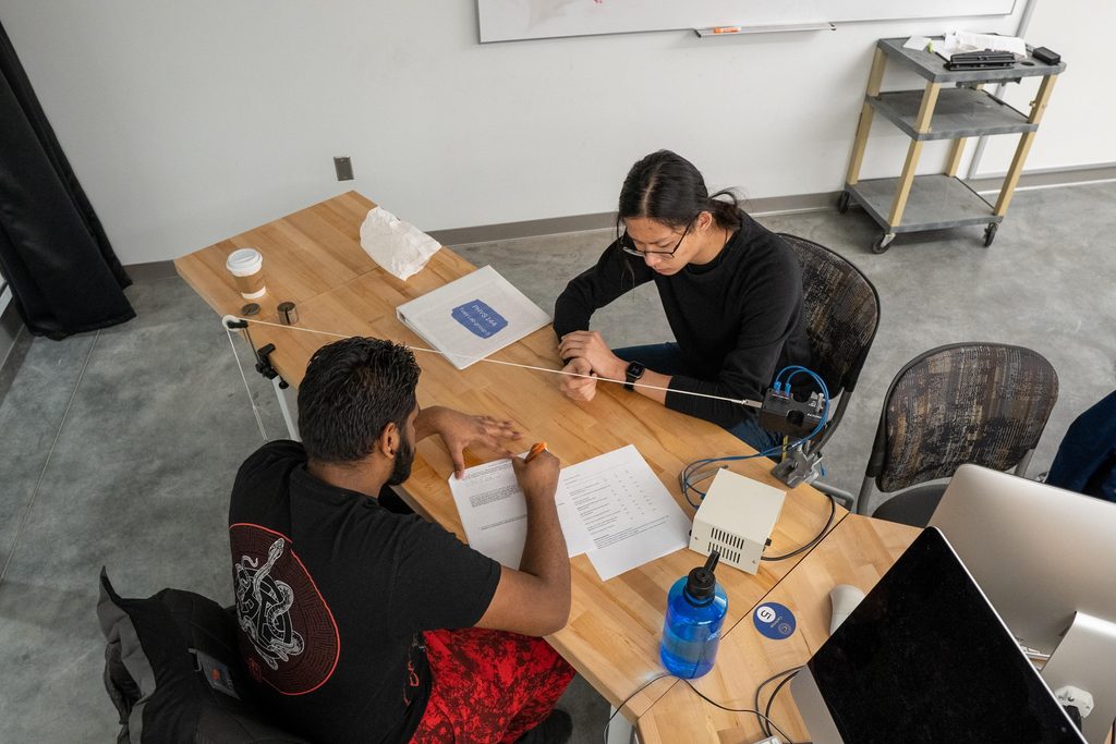 students participating in a physics lab on lightspeed