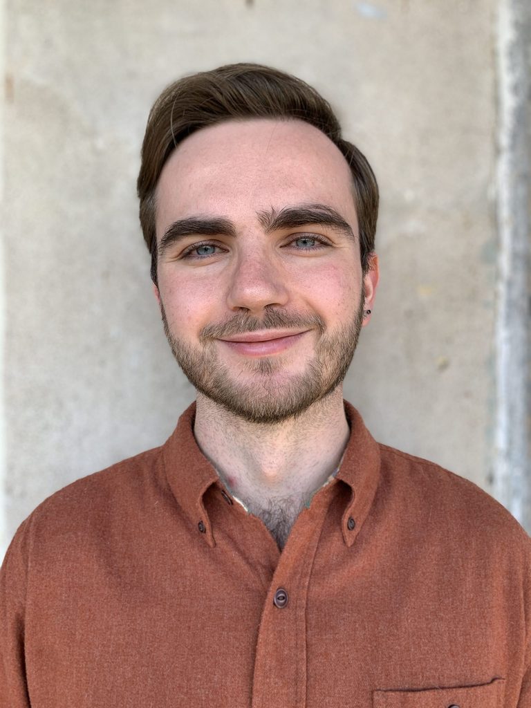 Photo of person wearing an orange shirt