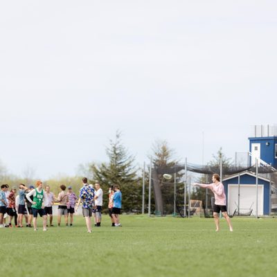 students playing frisbee on a field