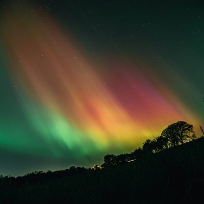 View of rainbow-colored Northern Lights from the Arb.