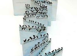 folded book with penguins