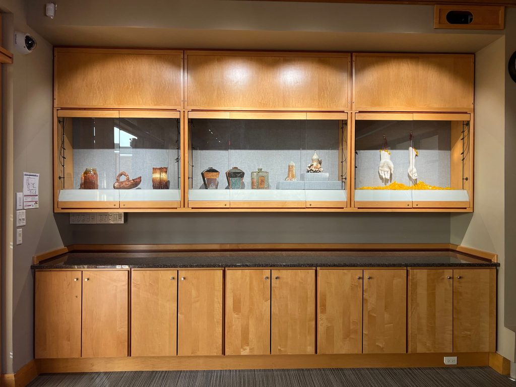 an image of ceramic works on display in the library athenaeum