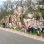 Students gathered on side of road admiring rock formations