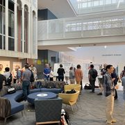 People looking and talking about scientific posters