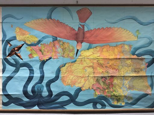A large, rectangular map showing three islands, a bird, and an octopus. The islands are positioned diagonally across the map (NW to SE). The bird is painted in warm colors ranging from dark pink to yellow and is positioned in the top half of the map, with its wings spread wide. The octopus is painted in hues of blue and primarily occupies the bottom left corner of the map, but its tentacles extend across the map, disappearing under the islands at times.