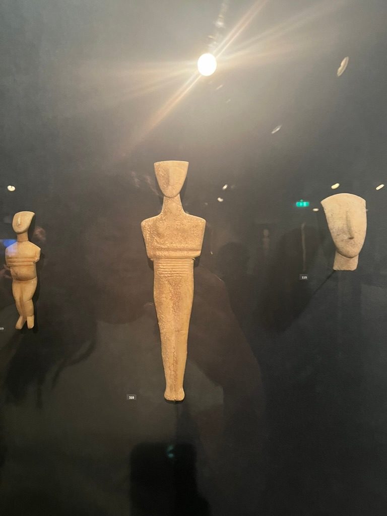 Figurine displayed upright, but it would have been lying down in a coffin. 