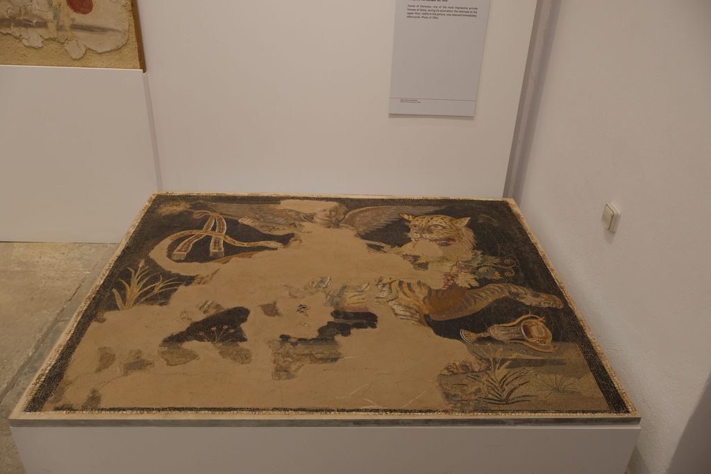 Mosaic depicting greek god Dionysus riding a tiger (some pieces missing)