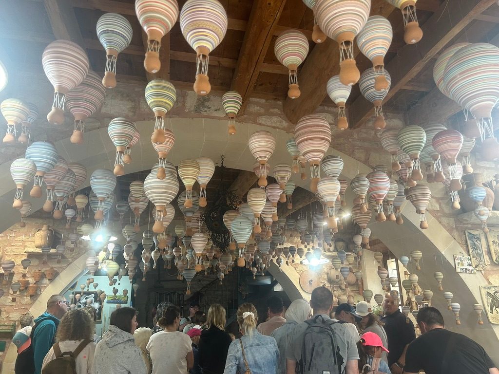 Colorful, striped hand made hot air balloons in the Keramion studio of Margarites village 