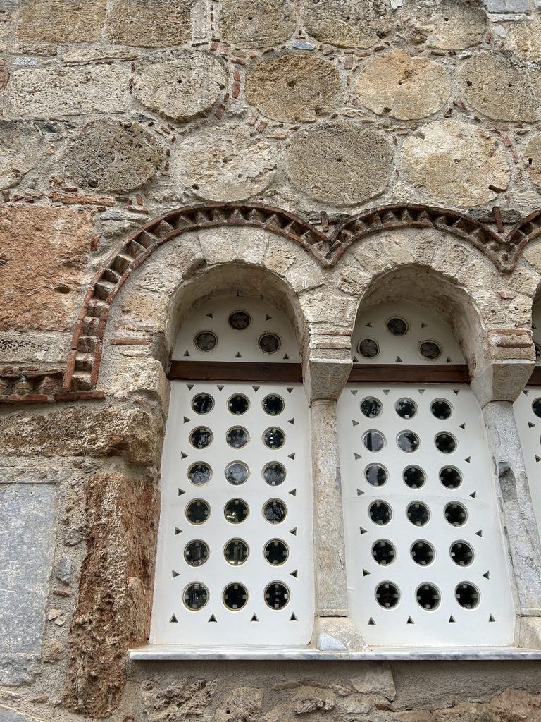 wall of a monastery with column drums