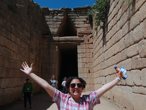 The author poses in front of a tholos tomb at Mycenea.