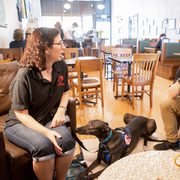 The Colemans with their dog Dandy at a coffee shop
