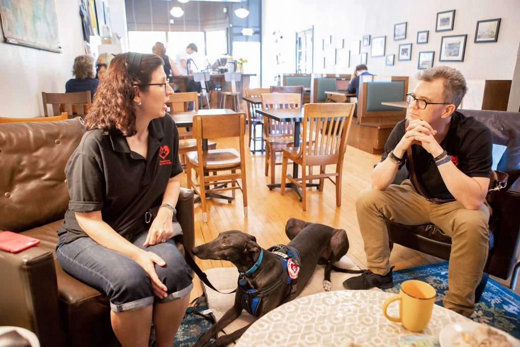 The Colemans with their dog Dandy at a coffee shop