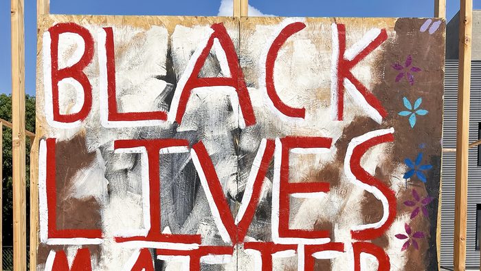 Spray-painted sign: Black Lives Matter