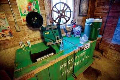 Old-fashioned film projector inside a barn