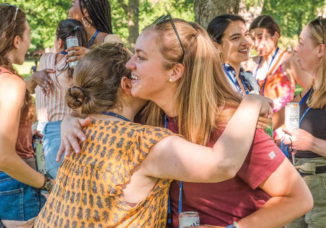 Classmates greet each other at the 2022 Milestone Reunion