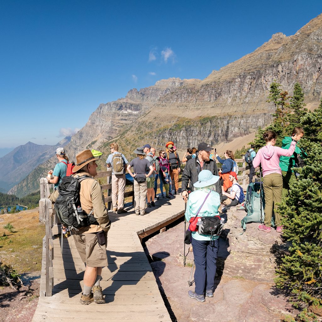 A crowd of people outdoors in a national park