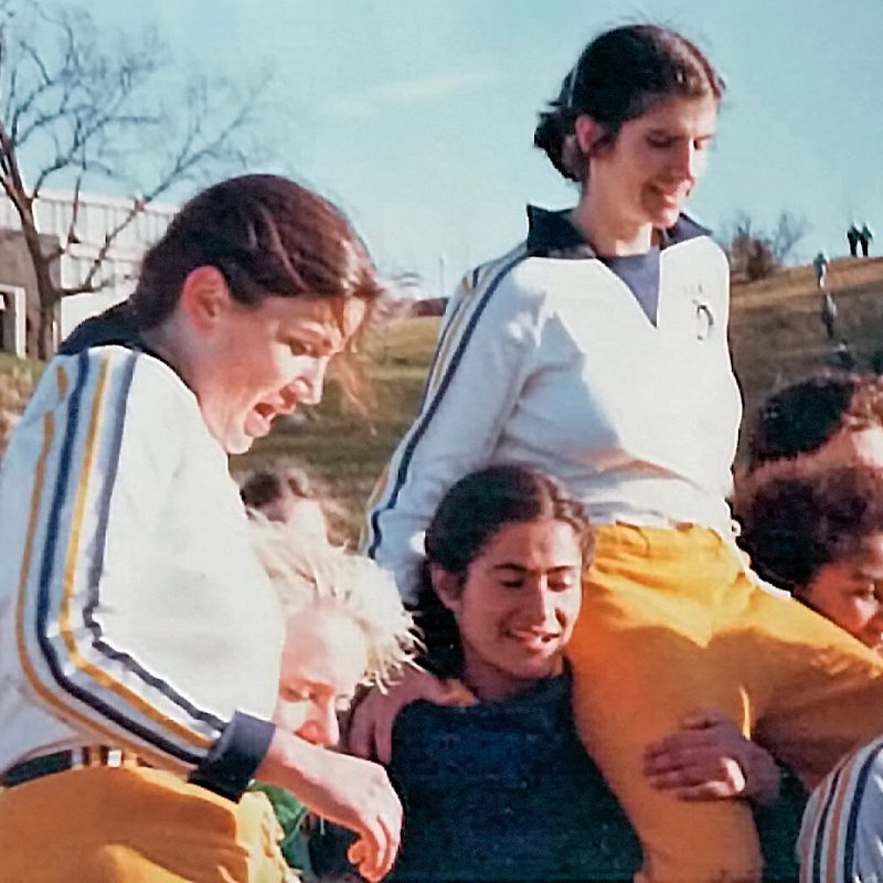 Women's soccer players celebrating a championship victory in 1981