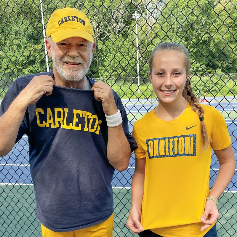 Burt Saxon and Kiley Pickens wear Carleton T-Shirts at a tennis court