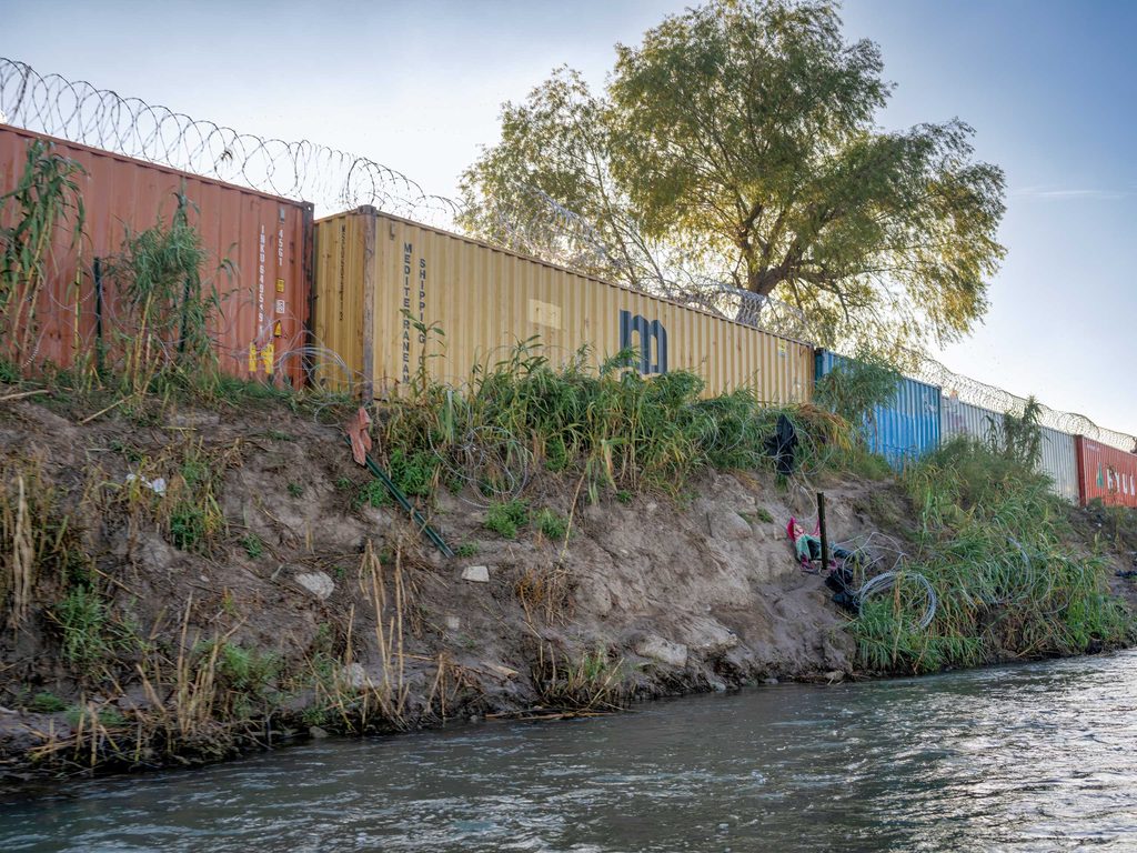 shipping containers along a body of water