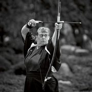 Carly Born practicing kyudo, a form of archery