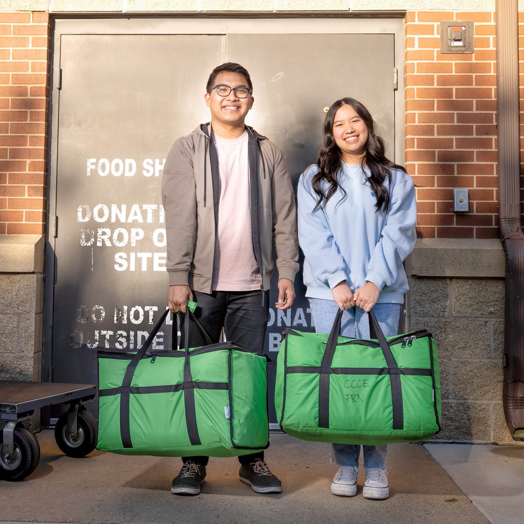 Jonathan Nguyen and Amanda Ta with hot food carriers