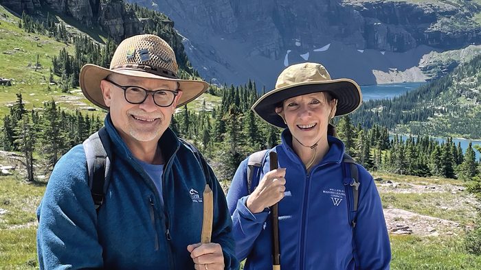Stephen Jensen and Alison Byerly hiking in the mountains