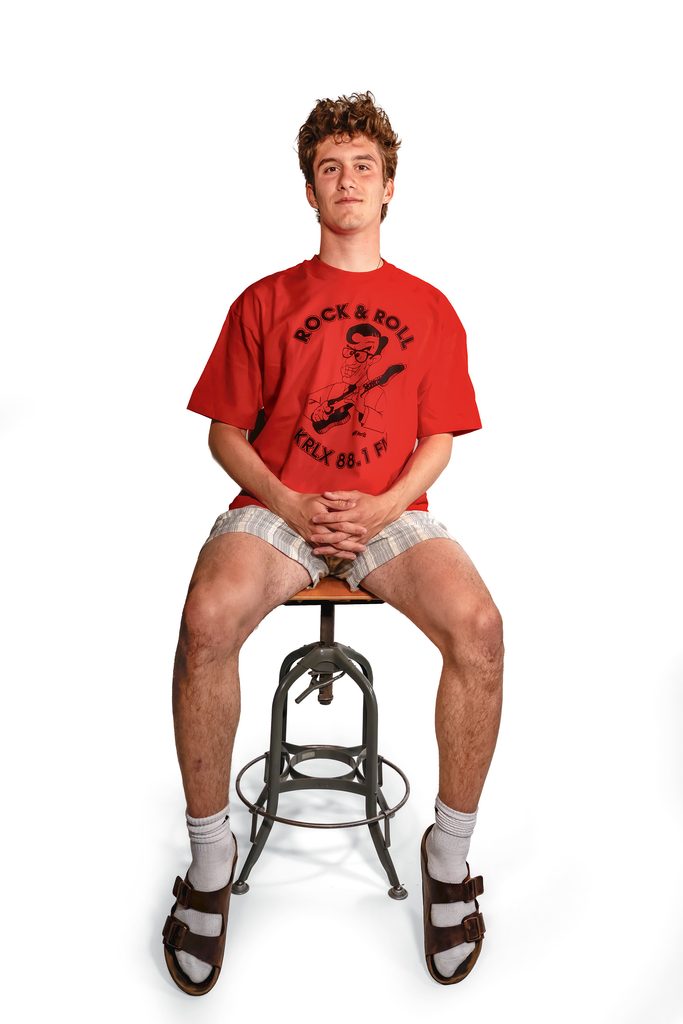 student seated wearing KRLX 1995 tshirt
