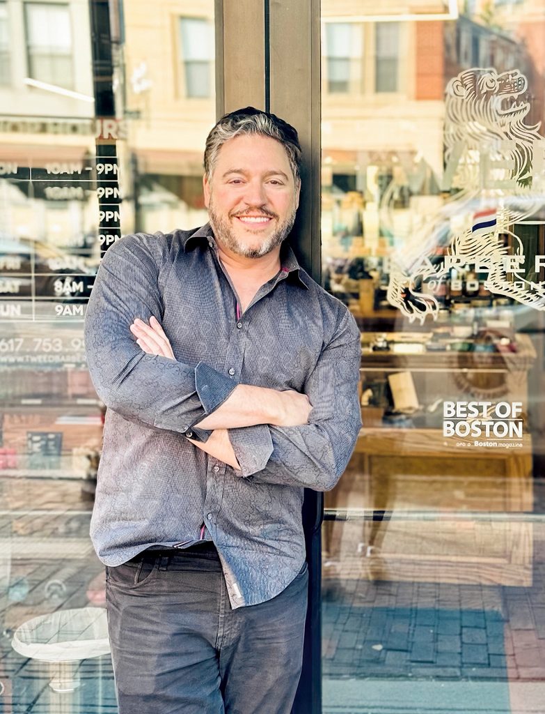 Peter Solomon ’93 poses outside barber shop doors