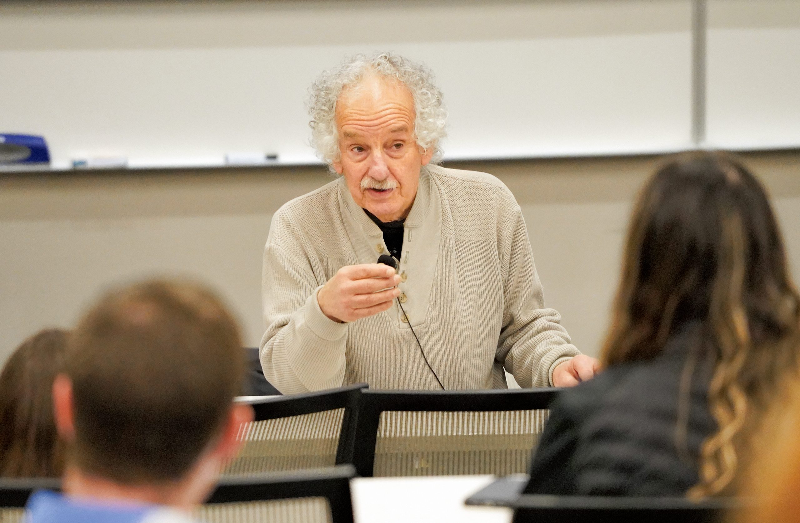 Lessing discusses with students in a classroom