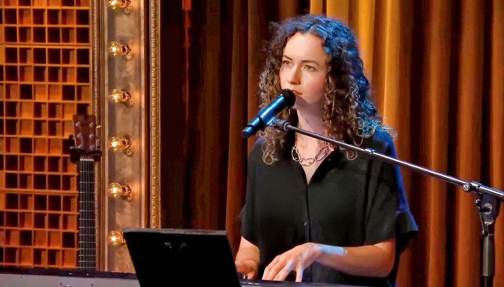 Rebecca McCartney ’21 playing piano and singing