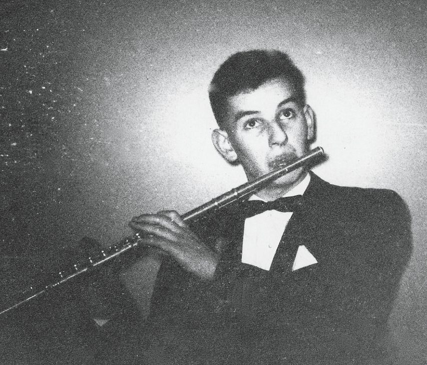 black and white photo of Fred Lessing playing flute